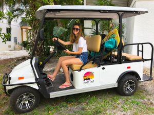A girl on a golf cart
